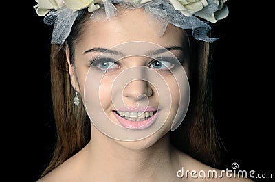 Beautiful woman with a wreath of flowers Stock Photo