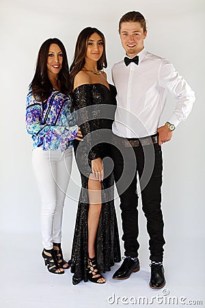 Beautiful woman in back prom dress and handsome guy in suit, teenager ready for a luxury night. Stock Photo