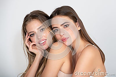 Beautiful women with beauty makeup and cosmetics. Close-up of couple beautiful girlfriends models. Two attractive Stock Photo