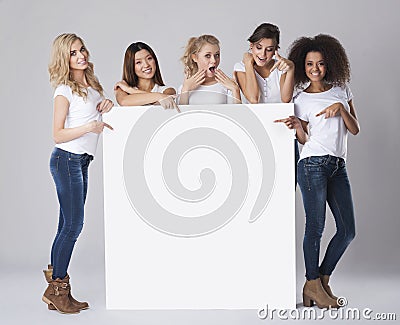 Beautiful women with empty board Stock Photo