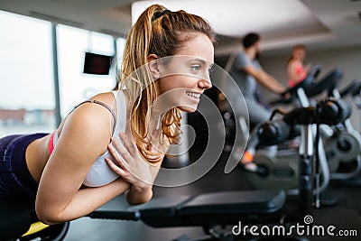 Beautiful woman working out in gym Stock Photo