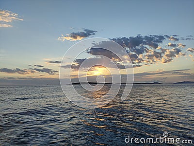 Beautiful wonderful sunset at evening in the ocean romantic with clear sky in Croatia on an island Stock Photo