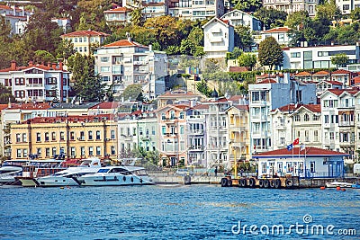 Beautiful wooden buildings in Arnavutkoy area of the city lined up by the Bosphorus Stock Photo