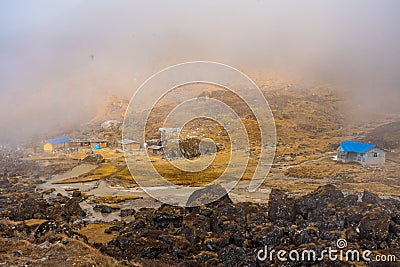 Beautiful Wooden Houses with a River in Sele La Pass of Kanchenjunga Conservation Himalayas in Nepal Stock Photo