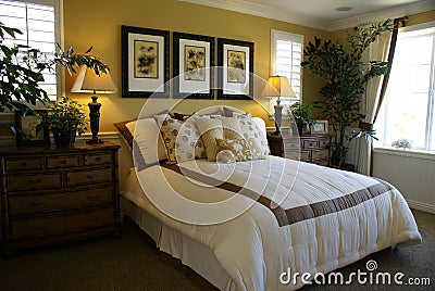Beautiful Yellow Master Bed Room Stock Photo