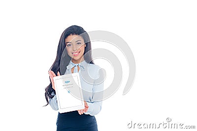 beautiful young african american woman holding digital tablet with skype application on screen and smiling at camera isolated Editorial Stock Photo