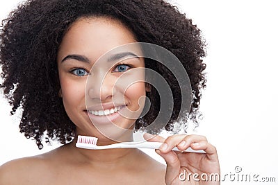 Beautiful young african teenage smile with brushing teeth . Dental health background. Stock Photo