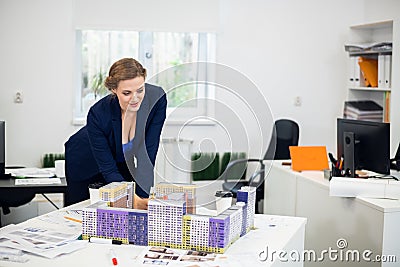 A beautiful young architect with her construction model Stock Photo
