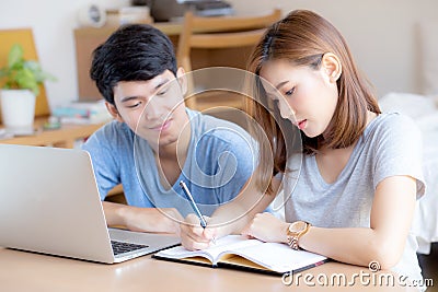 Beautiful young asian couple calculate expenses finance with laptop and planning together Stock Photo