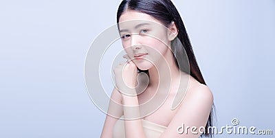 Beautiful Young asian Woman with Clean Fresh Skin look at camera. Girl beauty face care. Facial treatment. Cosmetology, beauty and Stock Photo