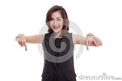 Beautiful young Asian woman point down to blank space. Stock Photo