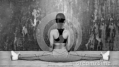 Beautiful young asian Woman Working Out, doing Pilates Exercise in Sportswear. Splits with Yoga Asana, Stretching Stock Photo