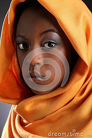 Beautiful young black girl wearing headress Stock Photo