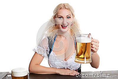 Beautiful young blond girl drinks out of oktoberfest beer stein Stock Photo