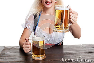 Beautiful young blond girl drinks out of oktoberfest beer stein Stock Photo