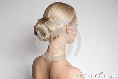 Beautiful Young Blond Woman With Bun HairstÑƒle. Stock Photo