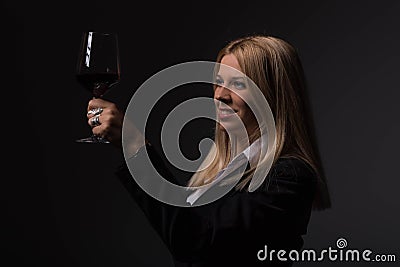 Women somelier tasting wine, drinking wine, holding glass Stock Photo