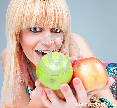 Beautiful young blondy with fresh apple Stock Photo