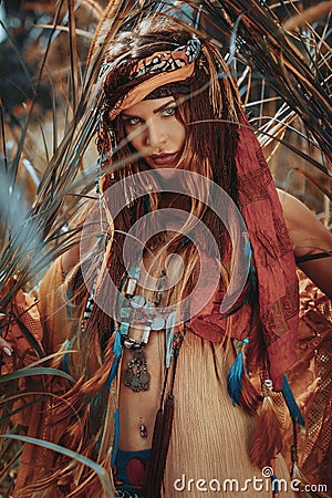 Beautiful young boho gypsy style woman outdoors Stock Photo