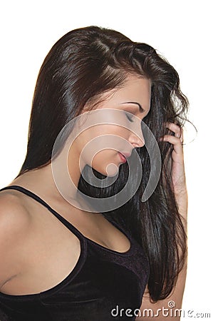 Beautiful young brunet girl with long shiny hair Stock Photo