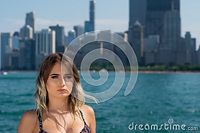 Beautiful Young Caucasian Girl with Barbell septum Nose Ring Horseshoe Nose Ring in Windy City at a sunny day. Stock Photo