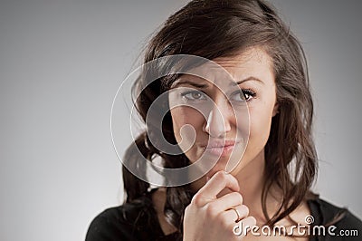 Beautiful Young Caucasian Woman Making A Decision Stock Photo