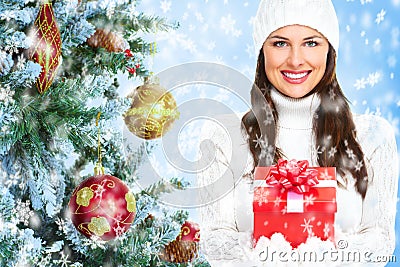 Beautiful young Christmas girl with a present. Stock Photo