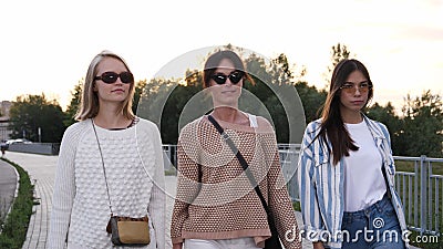 Beautiful, young and confident women walking. Models. Stock Photo