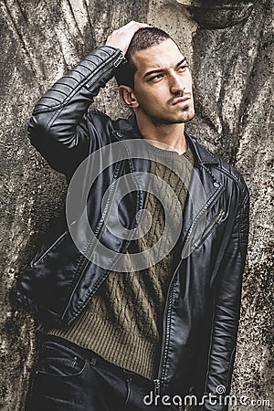 Beautiful young cool man with hand on head Stock Photo