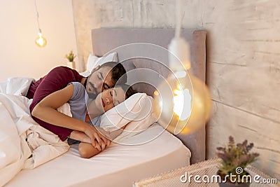 Couple spooning while sleeping Stock Photo