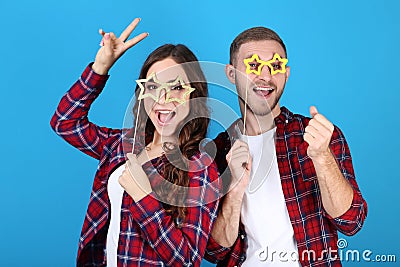 Young couple with paper booth props Stock Photo