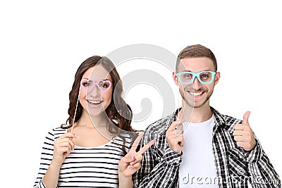 Young couple with paper booth props Stock Photo