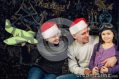 A beautiful young family dreams of a Christmas trip Stock Photo