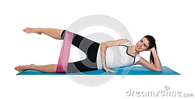 Beautiful young female exercising on a blue matt Stock Photo