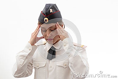 A beautiful young female Russian police officer in dress uniform in a cap and shoulder straps of a lieutenant colonel and a white Stock Photo