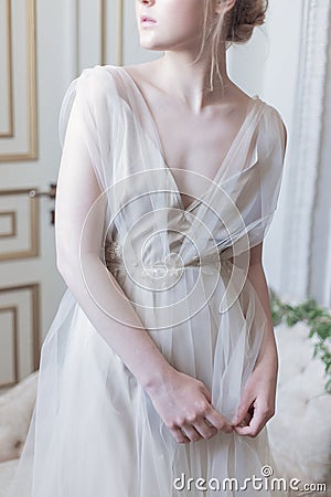 Beautiful young girl bride in a beautiful airy dress in beige colors , wedding in the style of boho Stock Photo