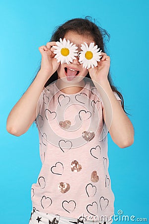 Beautiful young girl with daisy eyes Stock Photo