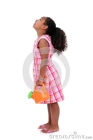 Beautiful Young Girl With Flower Watering Can Looking Up Stock Photo