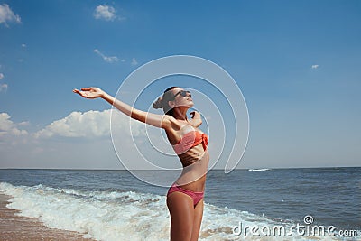 Beautiful young girl flying with seagulls on the sea Stock Photo
