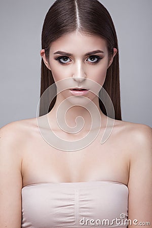 Beautiful young girl with a light natural make-up. Beauty face. Stock Photo