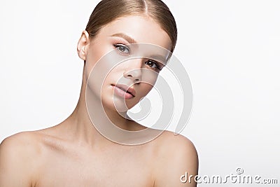 Beautiful young girl with a light natural make-up. Beauty face. Stock Photo