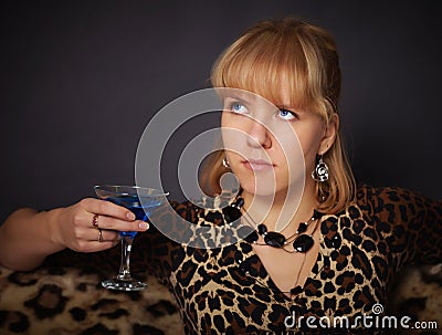 Beautiful young girl tries to exotic drink Stock Photo