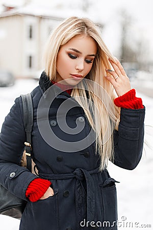 Beautiful young glamorous woman in a trendy winter coat Stock Photo