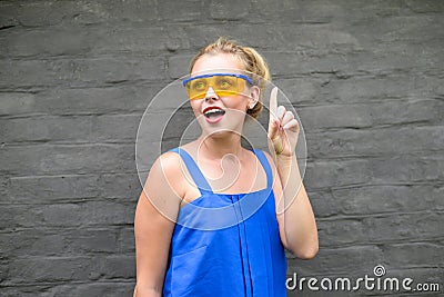 Beautiful young joyful lady gesturing 'eureka' on Stock Photo