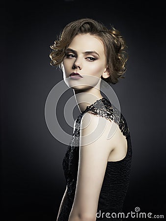 Beautiful young lady on black background Stock Photo