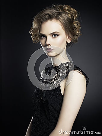 Beautiful young lady on black background Stock Photo