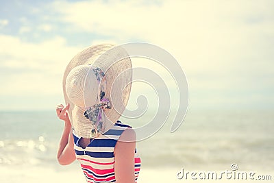 Beautiful young lady in straw hat resting on sunny Stock Photo