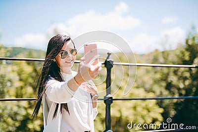 Beautiful young lady taking a selfie Stock Photo