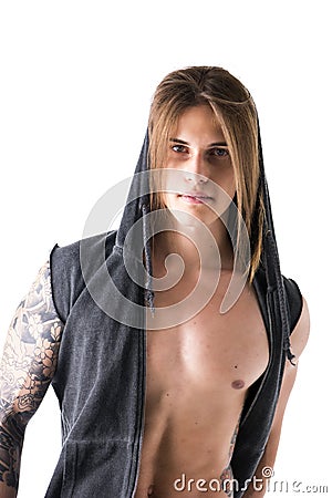 Beautiful young long haired man in hoodie jacket posing Stock Photo