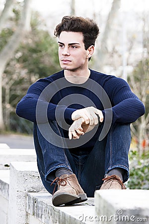 Beautiful young man model, trendy outfit hairstyle Stock Photo